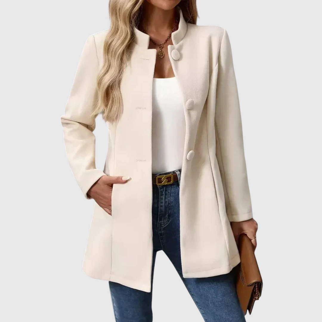 A woman wearing a tailored jacket with a neat stand collar and a button front