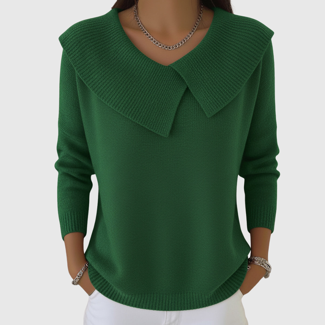 A woman wearing a soft collared sweater styled elegantly for a festive occasion.