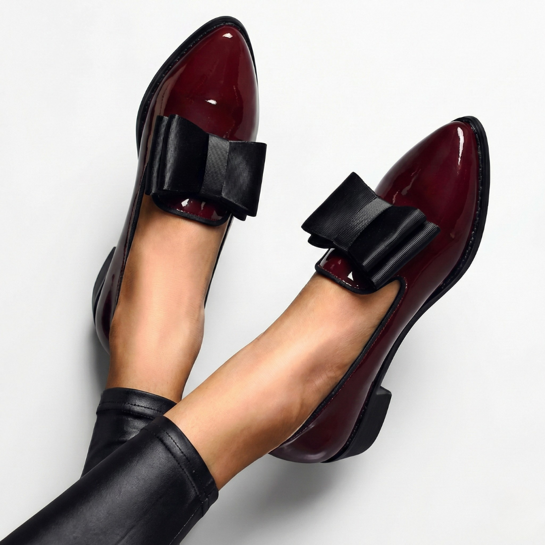 A woman wearing refined classic loafers with a smart everyday outfit