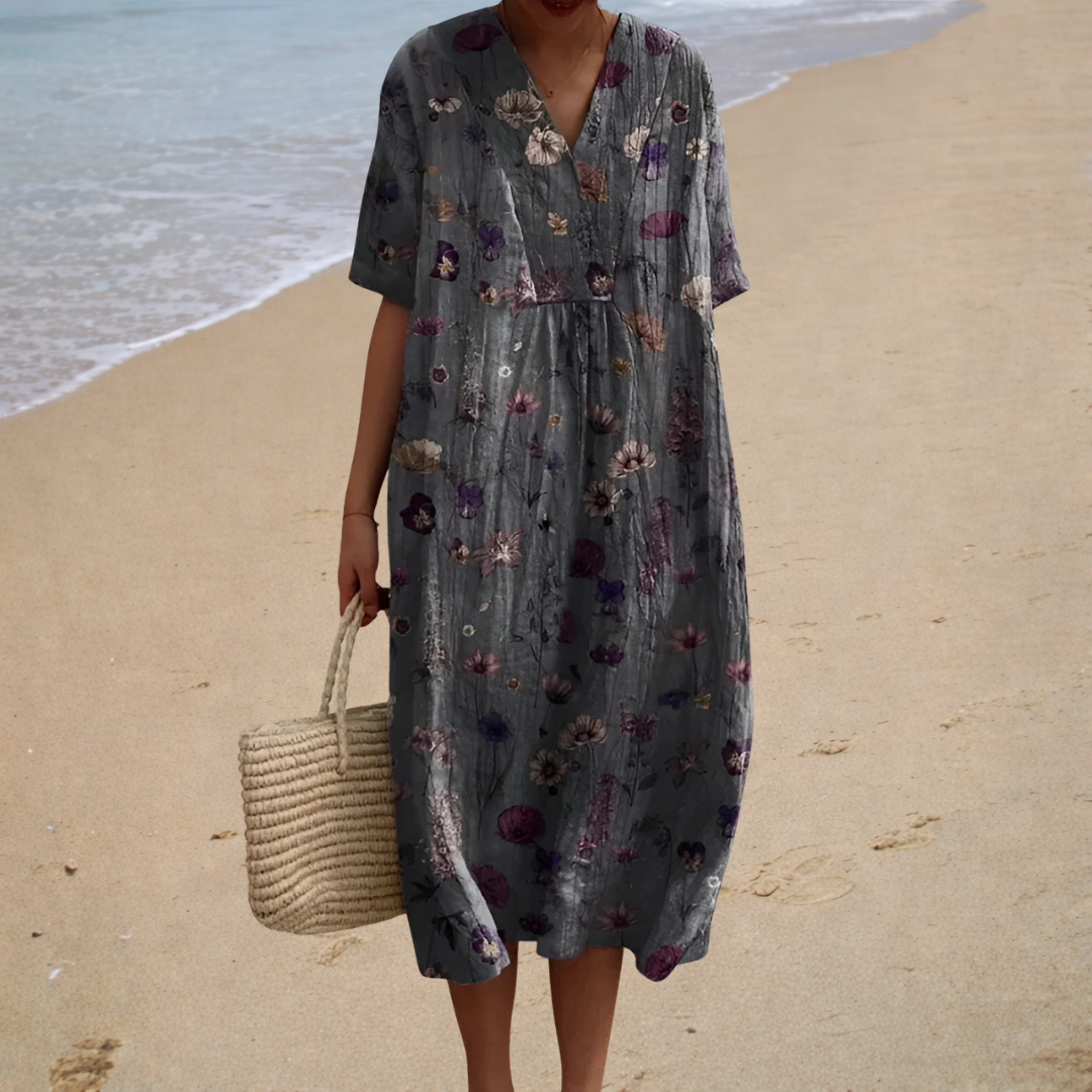 A woman wearing an airy relaxed printed summer dress, cool and comfortable on a hot day.