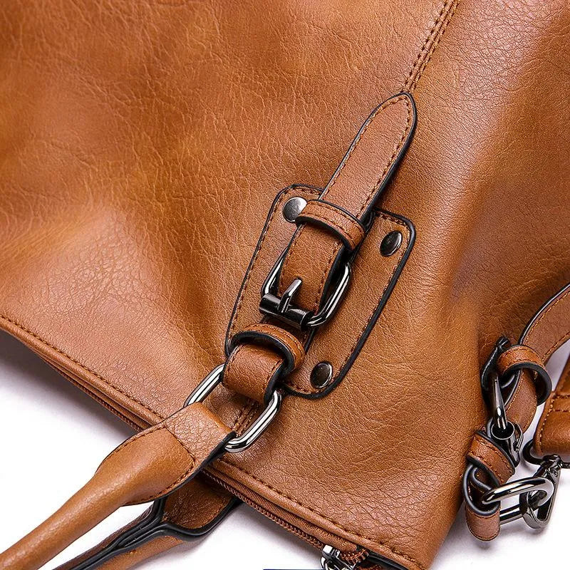 A woman carrying a soft slouchy shoulder bag with a rich finish on a relaxed day out