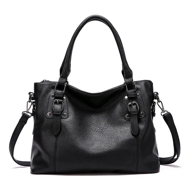 A woman carrying a soft slouchy shoulder bag with a rich finish on a relaxed day out