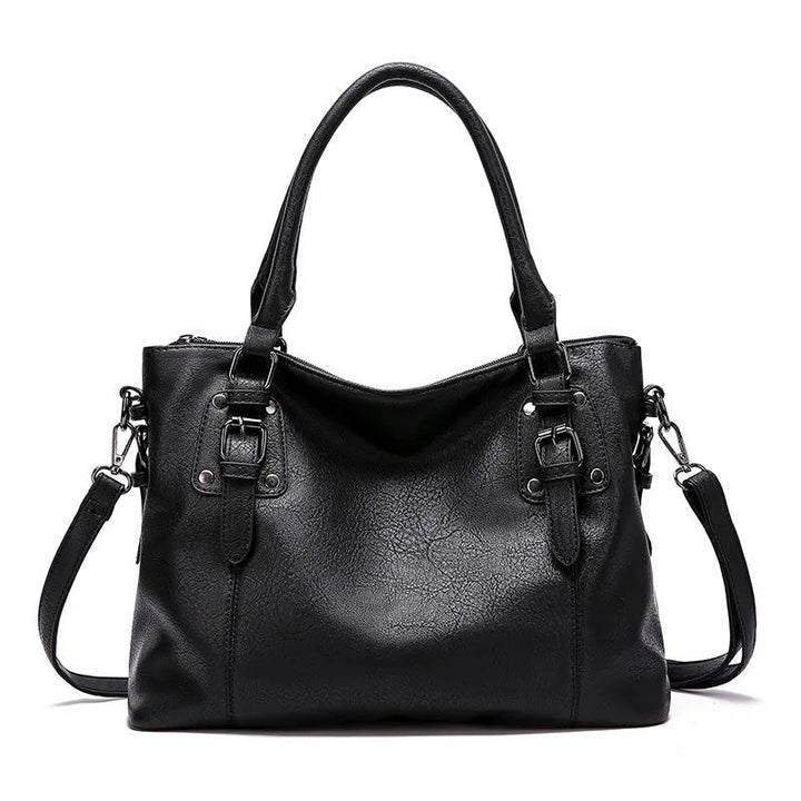 A woman carrying a soft slouchy shoulder bag with a rich finish on a relaxed day out