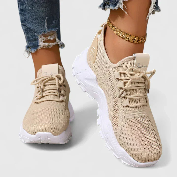 A woman wearing wide-toe cushioned orthopaedic sneakers