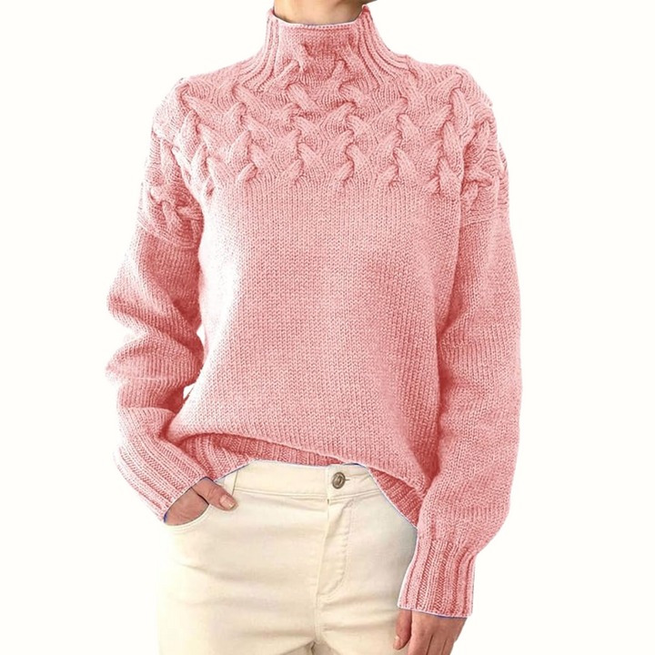 A woman wearing a warm roll-neck sweater, cosy and elegant on a cold winter day.