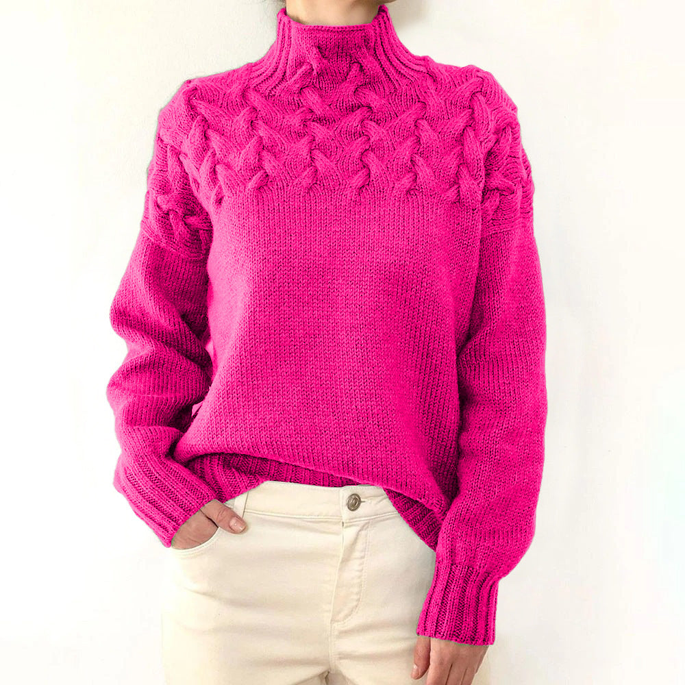 A woman wearing a warm roll-neck sweater, cosy and elegant on a cold winter day.
