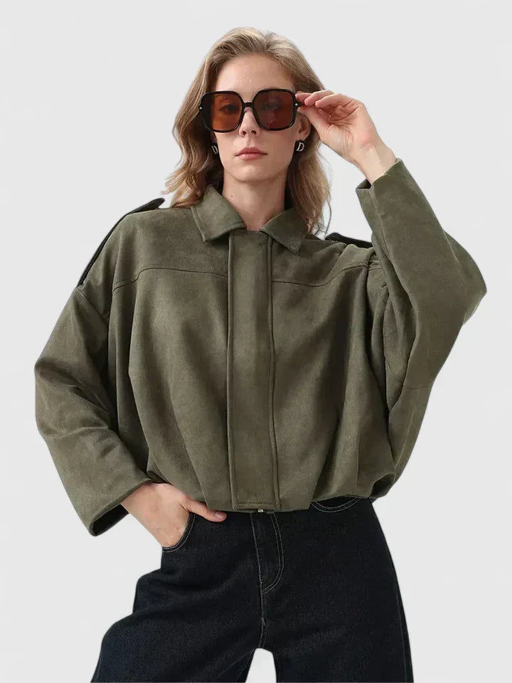 A woman wearing a classic versatile jacket, styled for a smart-casual day out.