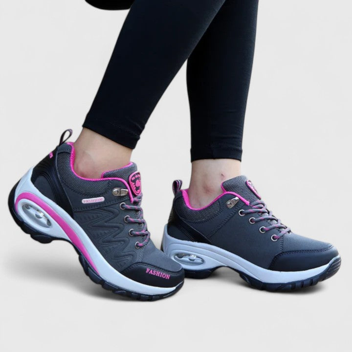 A woman wearing water-resistant comfort sneakers on a wet winter day