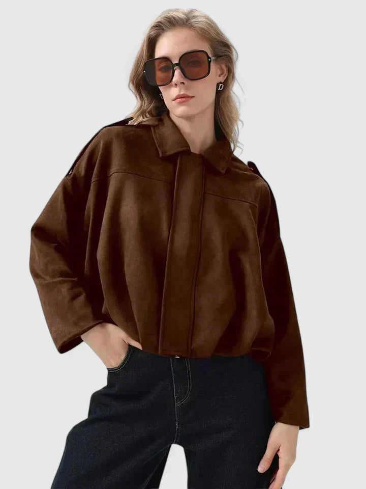 A woman wearing a classic versatile jacket, styled for a smart-casual day out.