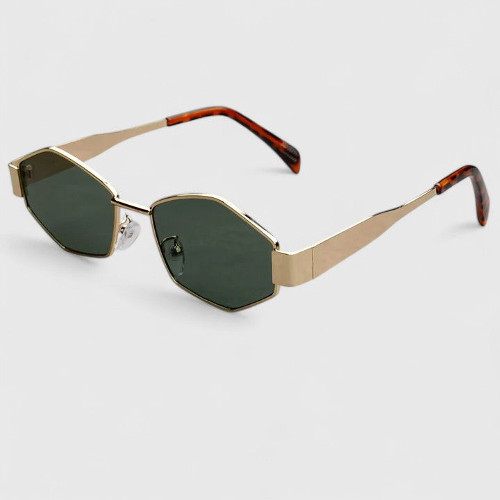 A woman wearing retro hexagonal metal-frame sunglasses on a sunny street.