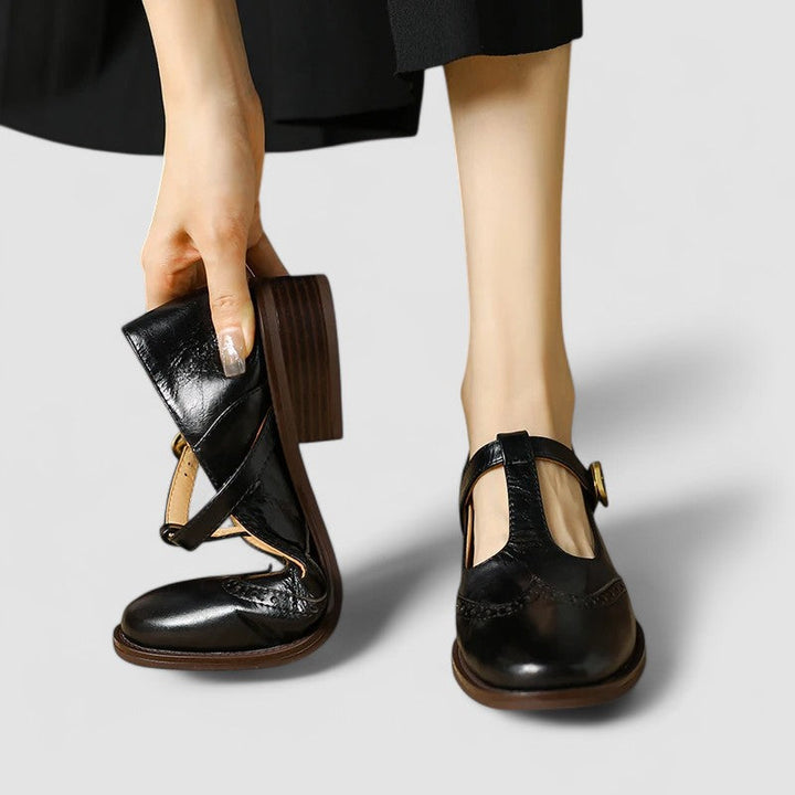A woman in beige T-strap Mary Jane shoes, comfortable and balanced on a busy day.