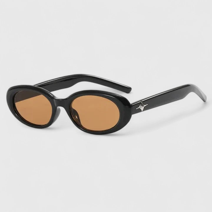 A woman in the city wearing chic oval sunglasses, confident and stylish in the sun.