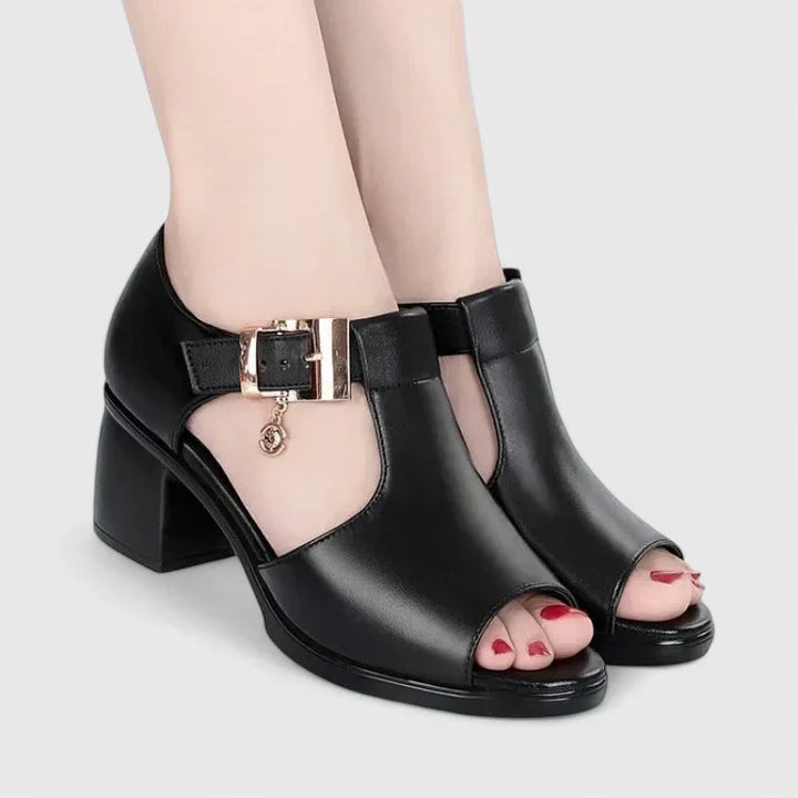 Black peep-toe sandals with a buckled instep strap and a sturdy block heel.