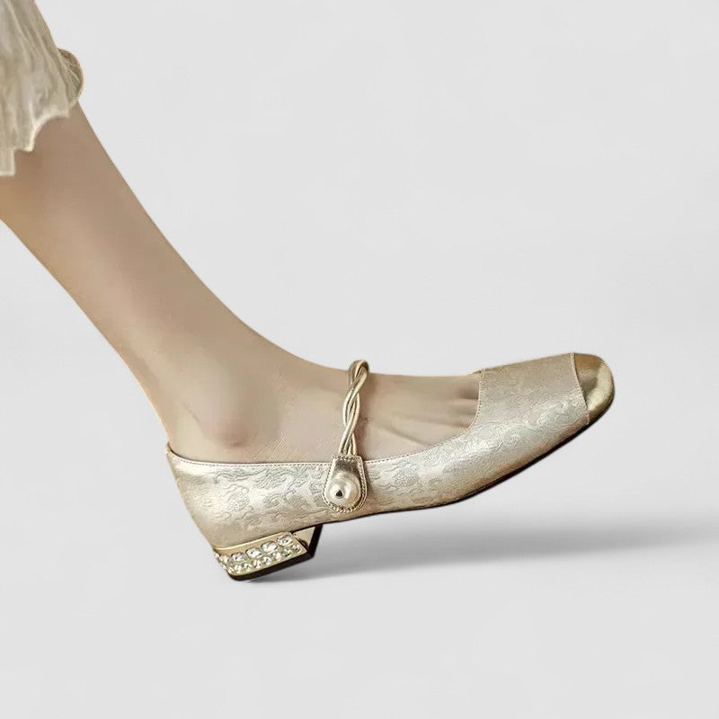 A woman wearing embellished green Mary Jane flats at a special occasion.