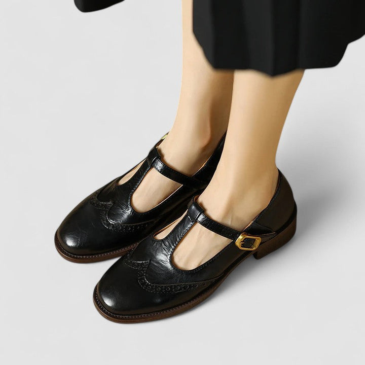 A woman in beige T-strap Mary Jane shoes, comfortable and balanced on a busy day.