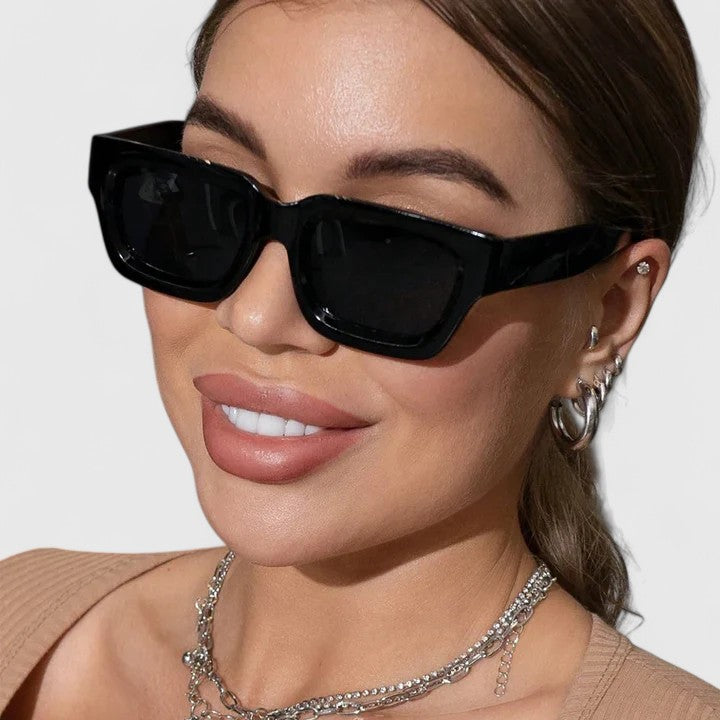 A woman out for the day wearing classic square sunglasses, relaxed and stylish in the sun.