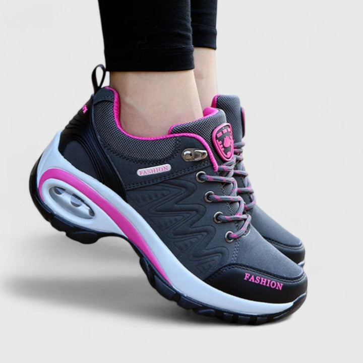 A woman wearing water-resistant comfort sneakers on a wet winter day