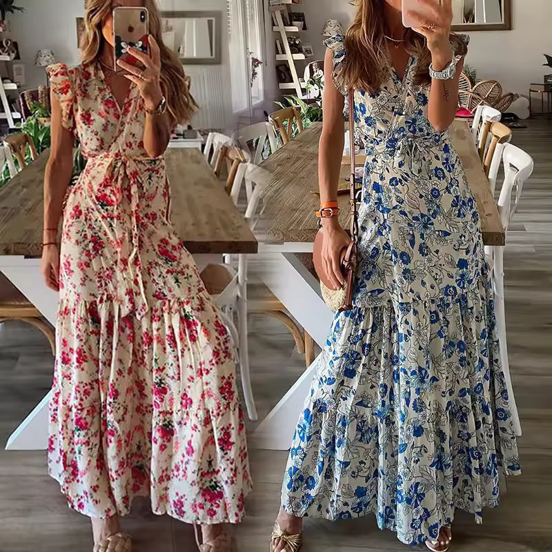 Woman in a flowing floral maxi dress with a tied waist at a summer garden gathering.