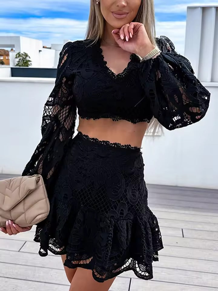 A woman wearing an elegant openwork two-piece set with romantic bell sleeves at an evening celebration