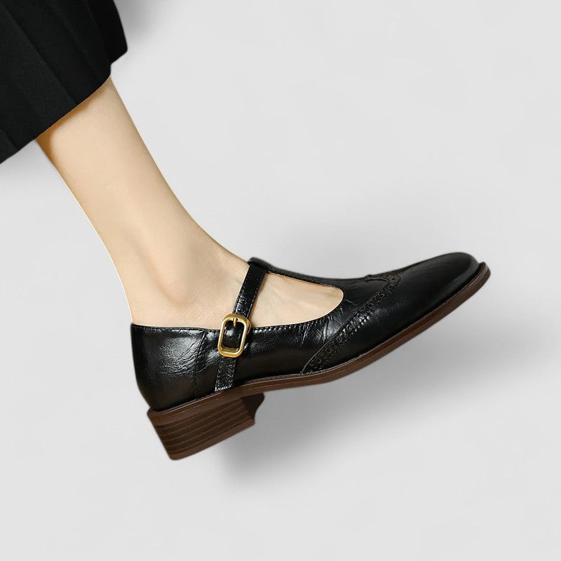 A woman in beige T-strap Mary Jane shoes, comfortable and balanced on a busy day.