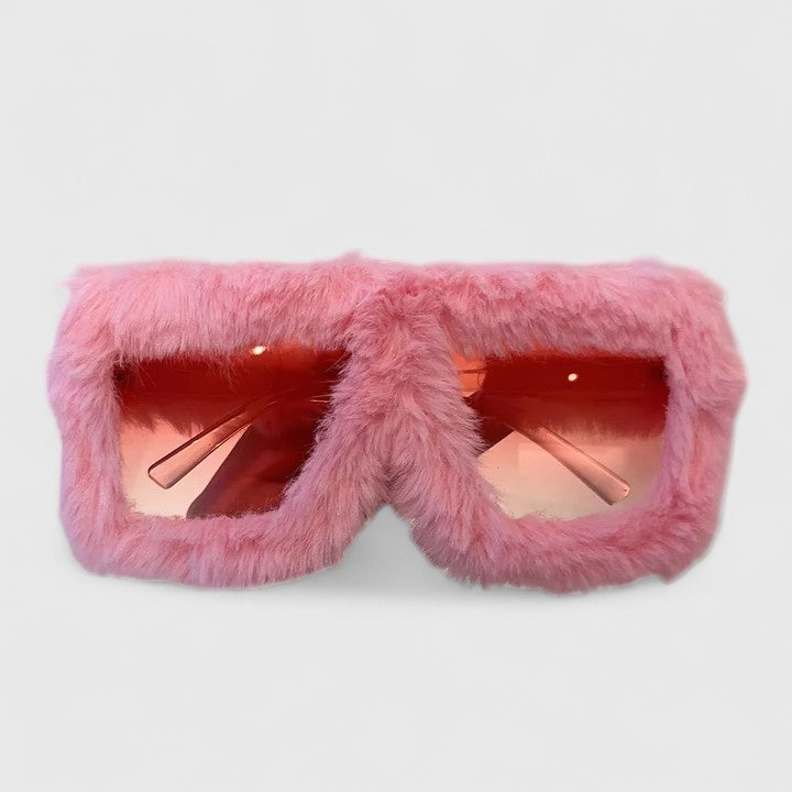 A bold pair of sunglasses with a soft red fluffy trim around the frame and slim black arms.