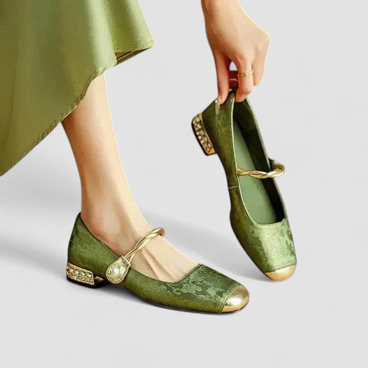 A woman in sparkling Mary Jane shoes with a low block heel at an evening celebration.