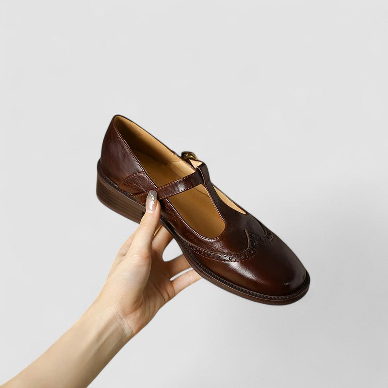 A woman in beige T-strap Mary Jane shoes, comfortable and balanced on a busy day.