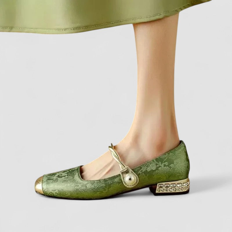 A woman in sparkling Mary Jane shoes with a low block heel at an evening celebration.