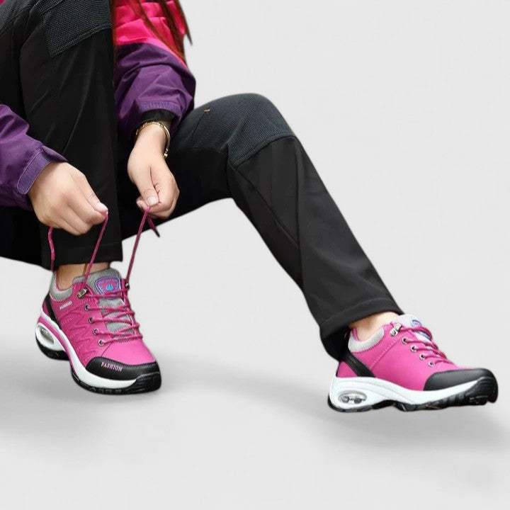 A woman wearing water-resistant comfort sneakers on a wet winter day