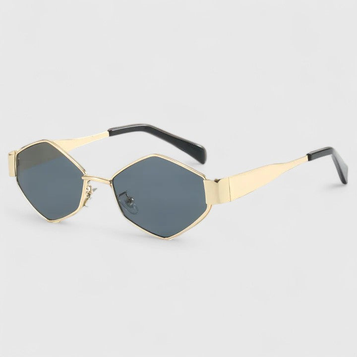 A woman wearing retro hexagonal metal-frame sunglasses on a sunny street.