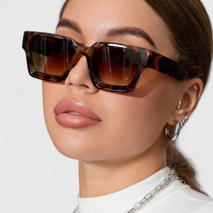 A woman out for the day wearing classic square sunglasses, relaxed and stylish in the sun.