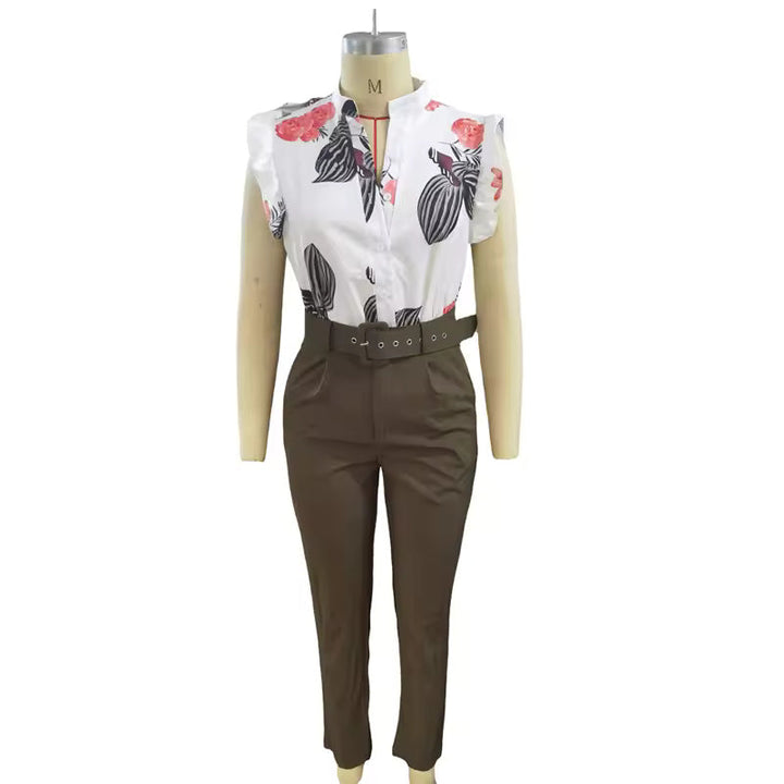 A woman wearing a floral ruffle-sleeve top with high-waisted pants, elegant and striking.