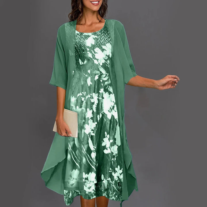 A woman wearing a flowing layered dress set with a printed inner dress, graceful and elegant.