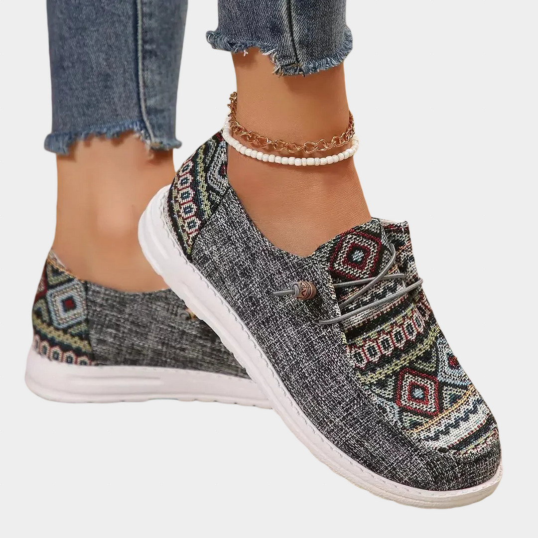 A woman wearing soft grey boho-print lace-up comfort shoes on a day out.