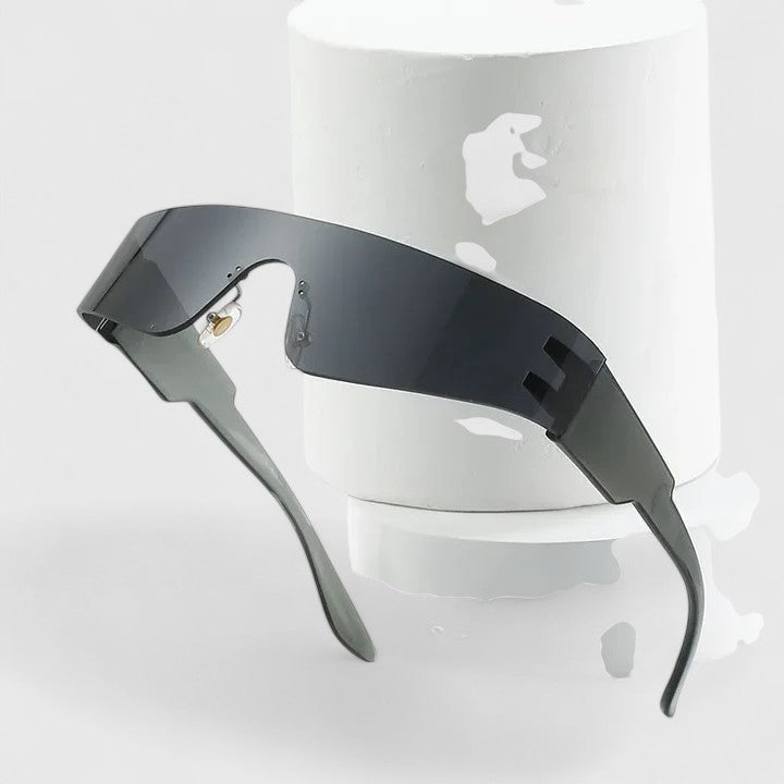 A pair of rimless wraparound sunglasses with a curved mirrored lens and flat black arms.