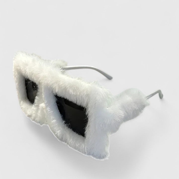 A bold pair of sunglasses with a soft red fluffy trim around the frame and slim black arms.