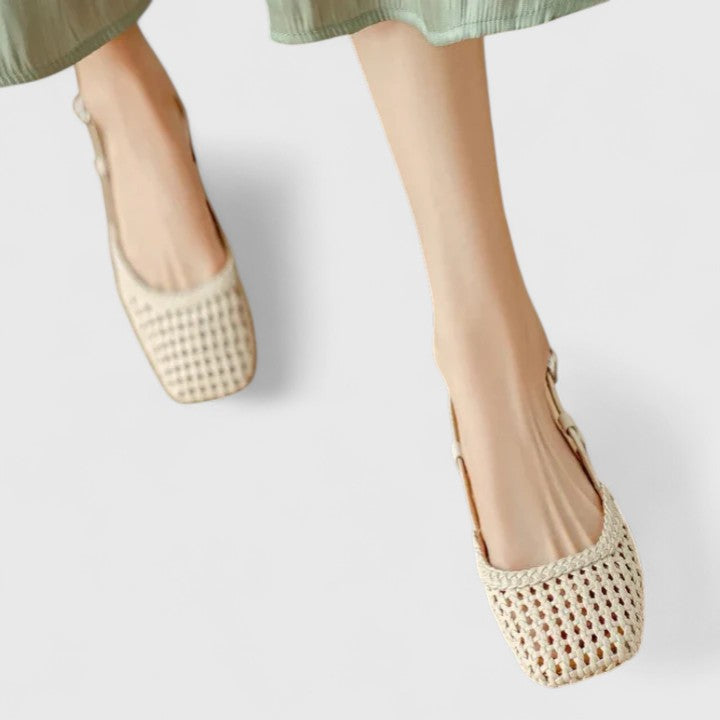 A woman wearing woven ballet flats with a square toe on an easy day out.
