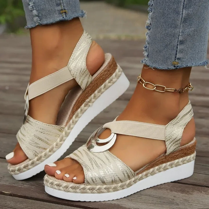 A woman moving with ease in supportive everyday sandals with an adjustable strap.