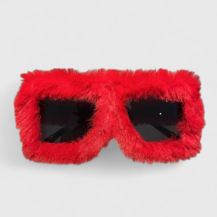 A bold pair of sunglasses with a soft red fluffy trim around the frame and slim black arms.