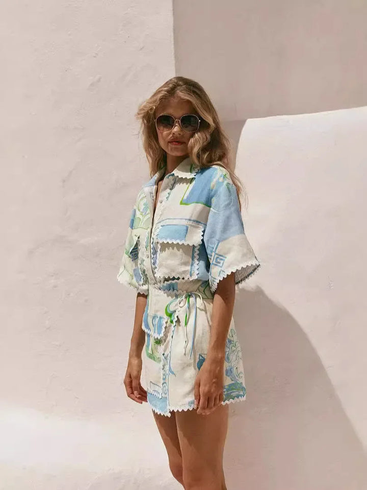 A woman wearing a patchwork print short-sleeve top and matching tie-waist shorts on a sunny day