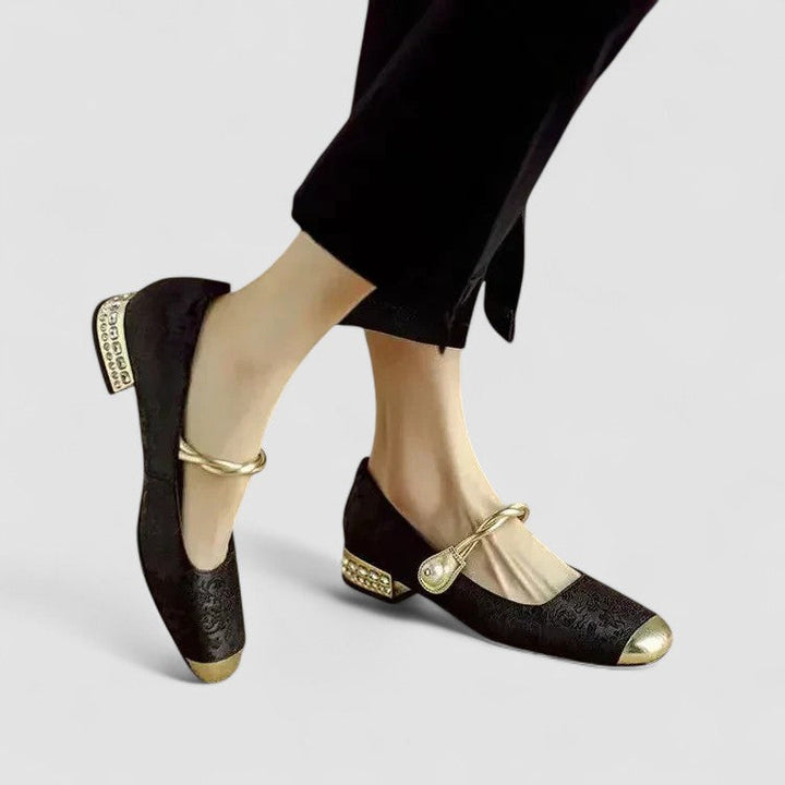 A woman in sparkling Mary Jane shoes with a low block heel at an evening celebration.