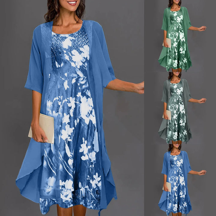 A woman wearing a flowing layered dress set with a printed inner dress, graceful and elegant.