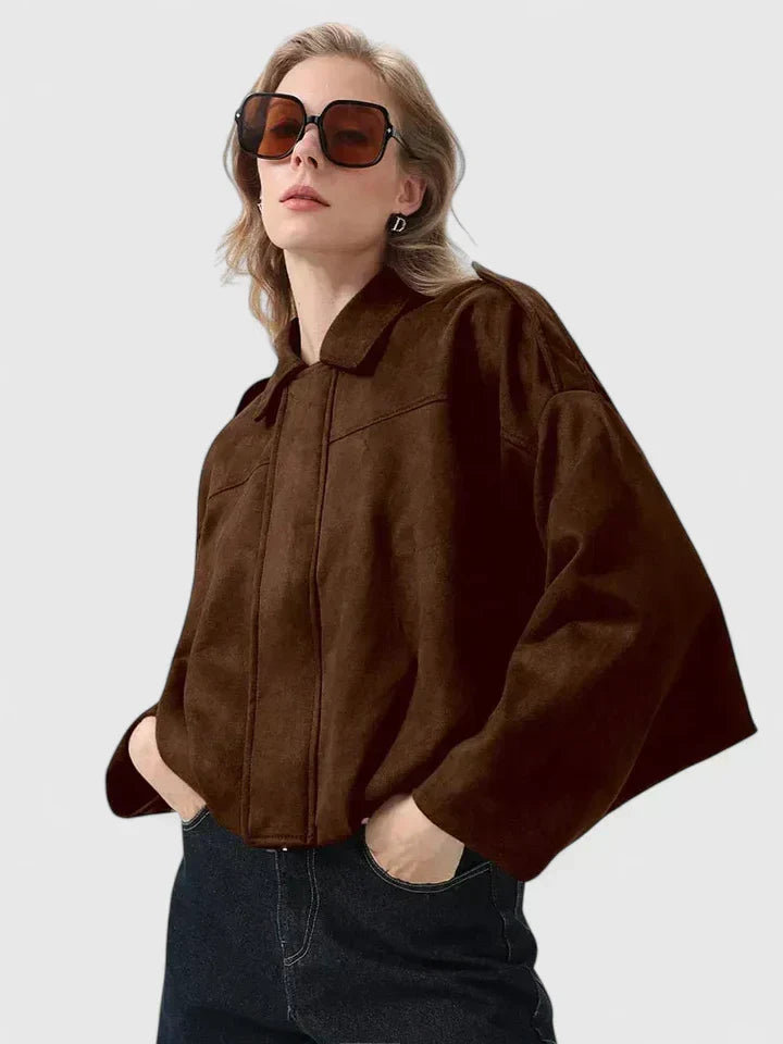 A woman wearing a classic versatile jacket, styled for a smart-casual day out.