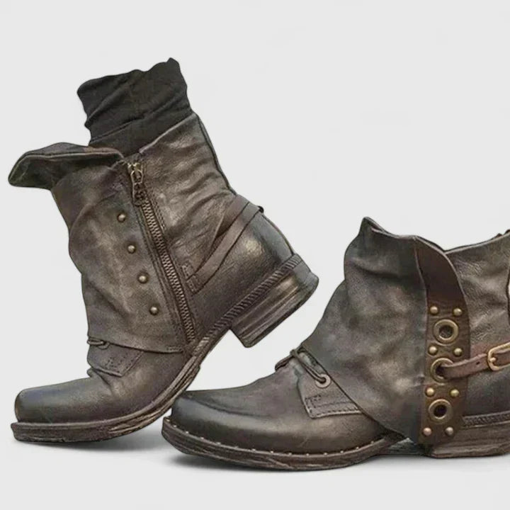 Woman wearing grey supportive ankle boots, walking confidently through town.