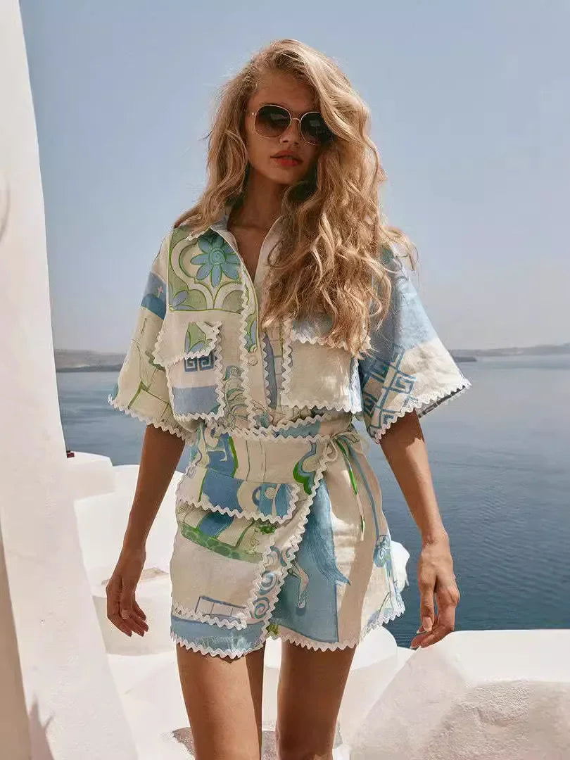 A woman wearing a patchwork print short-sleeve top and matching tie-waist shorts on a sunny day