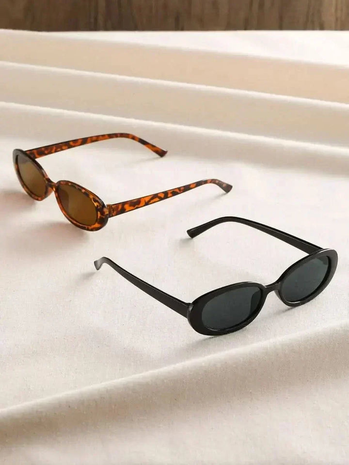 A woman wearing oval retro sunglasses while out shopping on a sunny day.