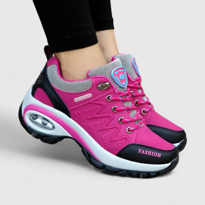 A woman wearing water-resistant comfort sneakers on a wet winter day
