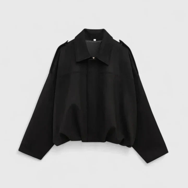 A woman wearing a classic versatile jacket, styled for a smart-casual day out.