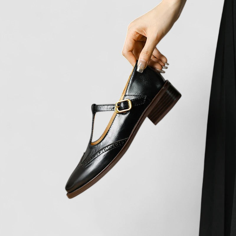 A woman in beige T-strap Mary Jane shoes, comfortable and balanced on a busy day.