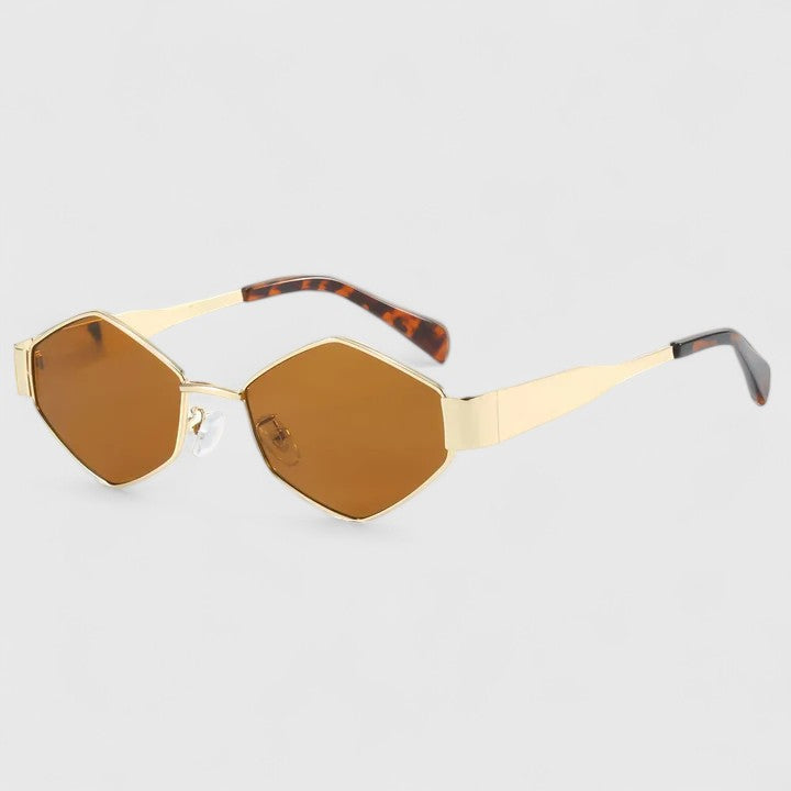 A woman wearing retro hexagonal metal-frame sunglasses on a sunny street.